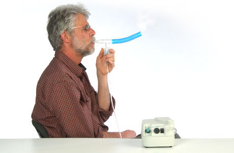 A man using a nebulizer.