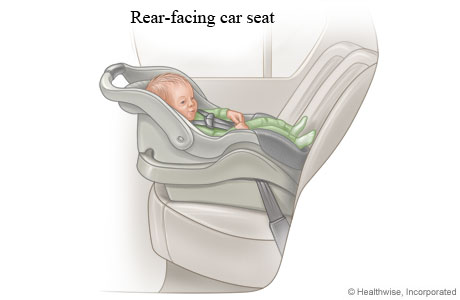 Baby in a rear-facing infant-only car seat.