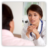 Photo of a care giver talking with patient