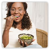 Photo of a woman holding a bowl of food