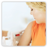 Photo of a woman getting a shot in her arm