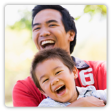 Photo of a man holding a child