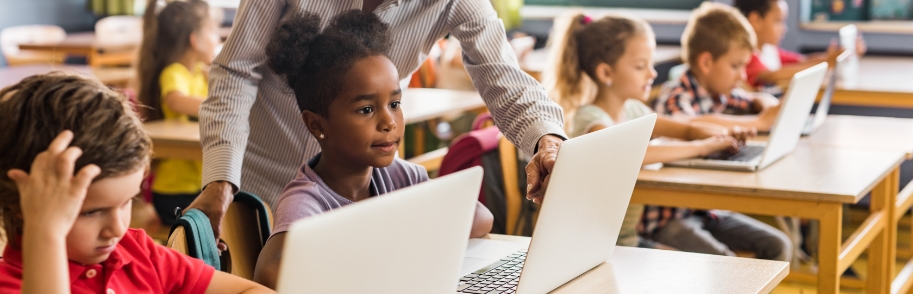 Students in a classroom working on laptops