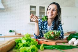 Person eating salad