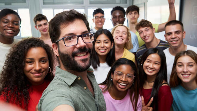 A diverse group of people looking at the camera.