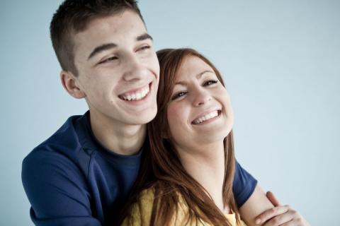 young couple embracing and smiling