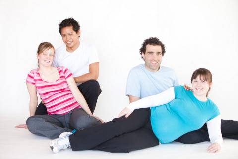 pregnant women with partners attending a prenatal class