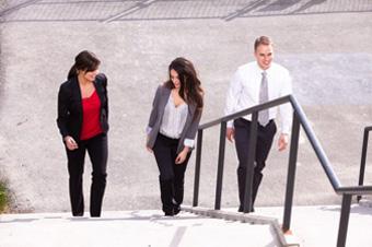 employees walking up office steps