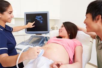couple in hospital, pregnant woman getting an ultrasound