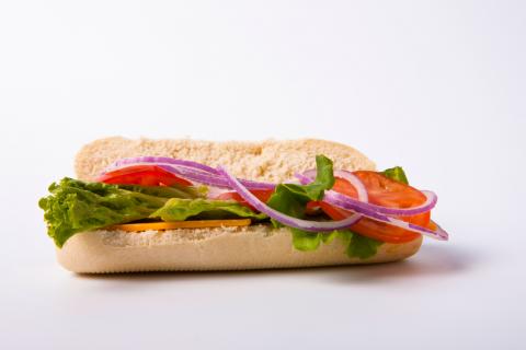sandwich with lettuce, tomato, onions and cheese