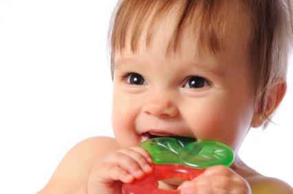 toddler biting a fruit gummy