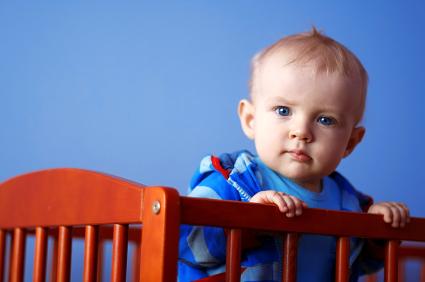 toddler wide awake standing up in crib