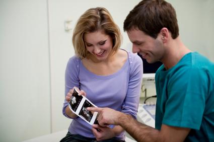 couple looking at prenatal screening test results