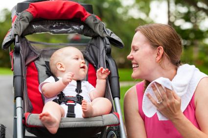 mom smiling with baby in stroller
