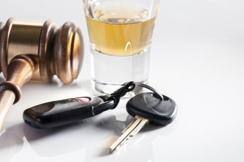 a gavel, an alcoholic beverage and car keys