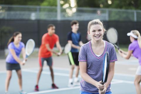 teens playing tennis