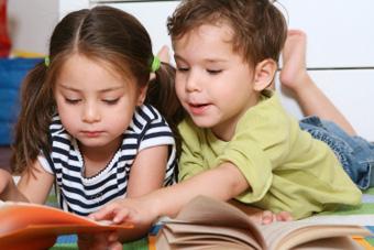 toddlers looking at books together
