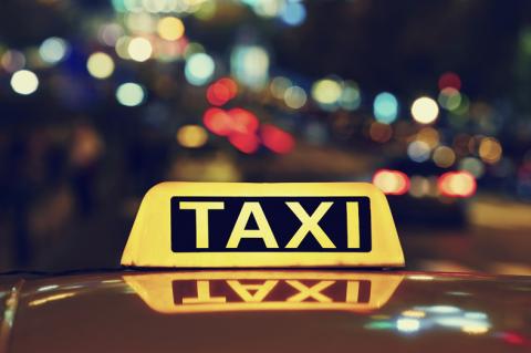 a taxi with sign illuminated