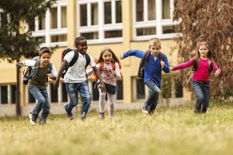 children running in school field